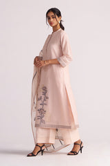 Woman wearing a Sepia Rose Woven Chanderi Kurta Set outfit with floral embroidery on a white background