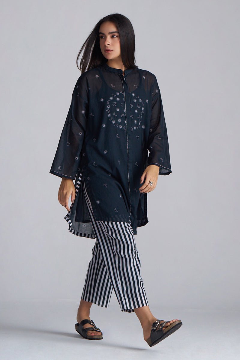 Woman wearing a dark outfit with a pattern, standing against a plain background | Black & White Mul Mul Co-ord Set for Women | Ganga Fashions