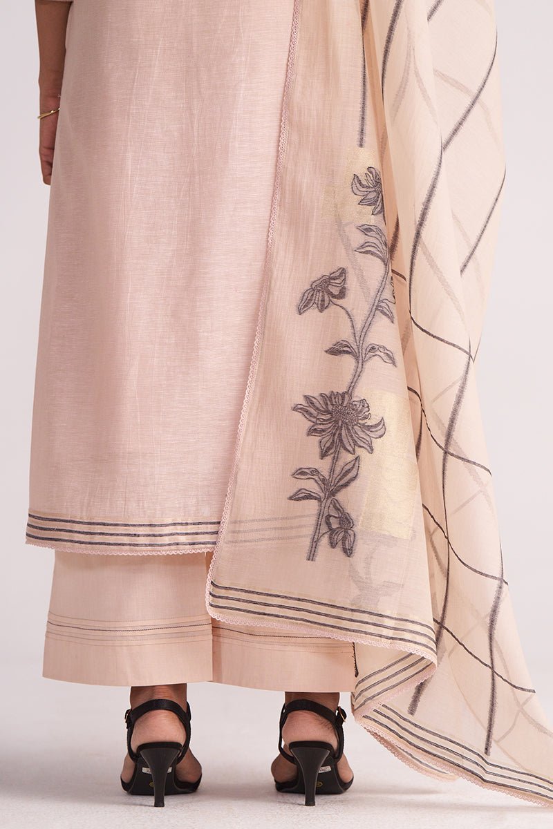 Sepia Rose Woven Chanderi Kurta Set with floral embroidery draped over a white background