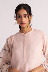 Woman wearing a Sepia Rose Woven Chanderi Kurta Set against a plain background
