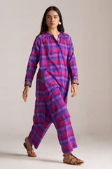 Woman wearing a purple and pink plaid outfit on a plain background | Purple Checkard Mul Mul Co Ord Set