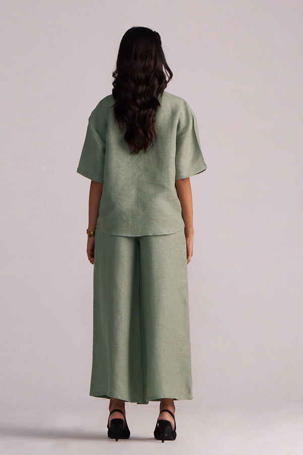 Person wearing a Lily Pad Green Pure Linen Co-ord Set on a plain background