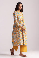 Woman wearing a Beige and Mustard Cotton Print Co-ord Set on a white background