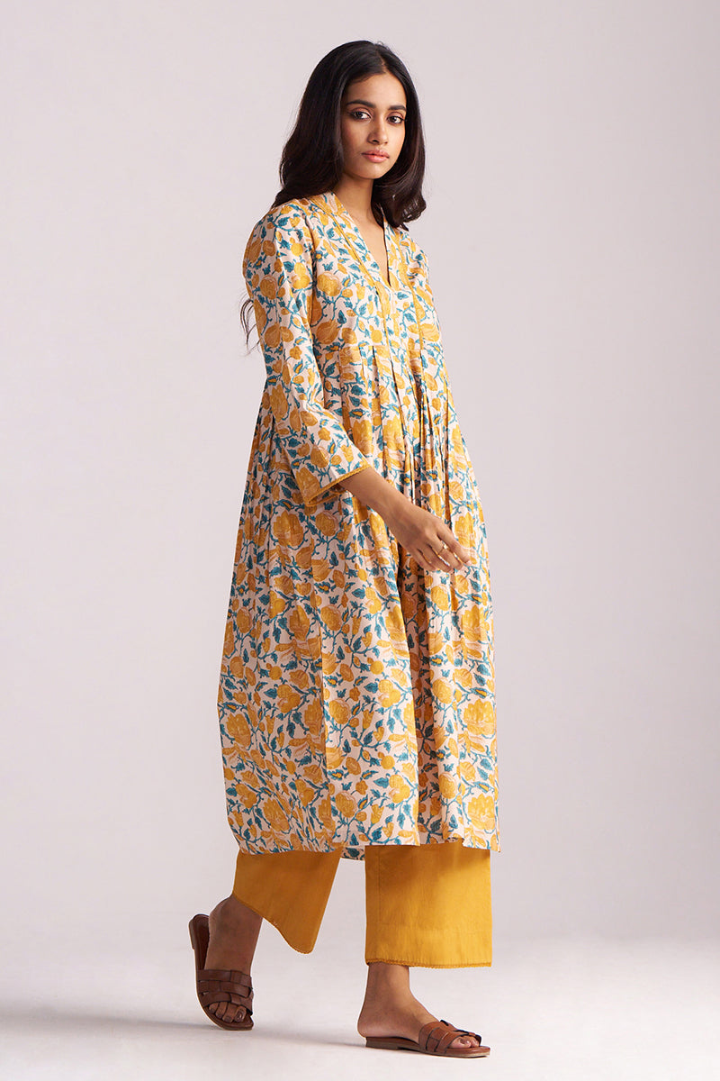 Woman wearing a Beige and Mustard Cotton Print Co-ord Set on a white background