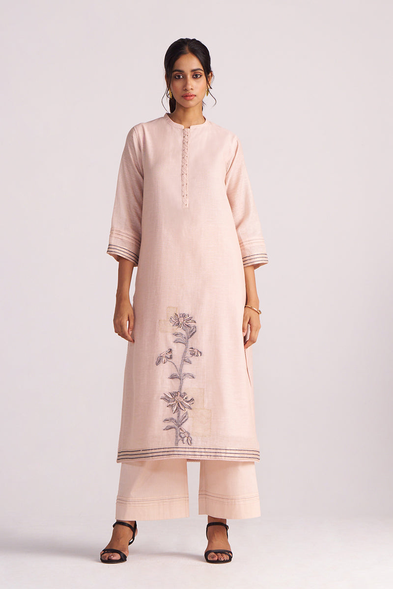Woman wearing a Sepia Rose Woven Chanderi Kurta Set with floral embroidery on a white background