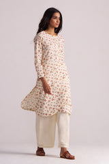 Woman wearing a Cream and Pink Tiny Floral Hand-Print Co-ord Set on a light gray background