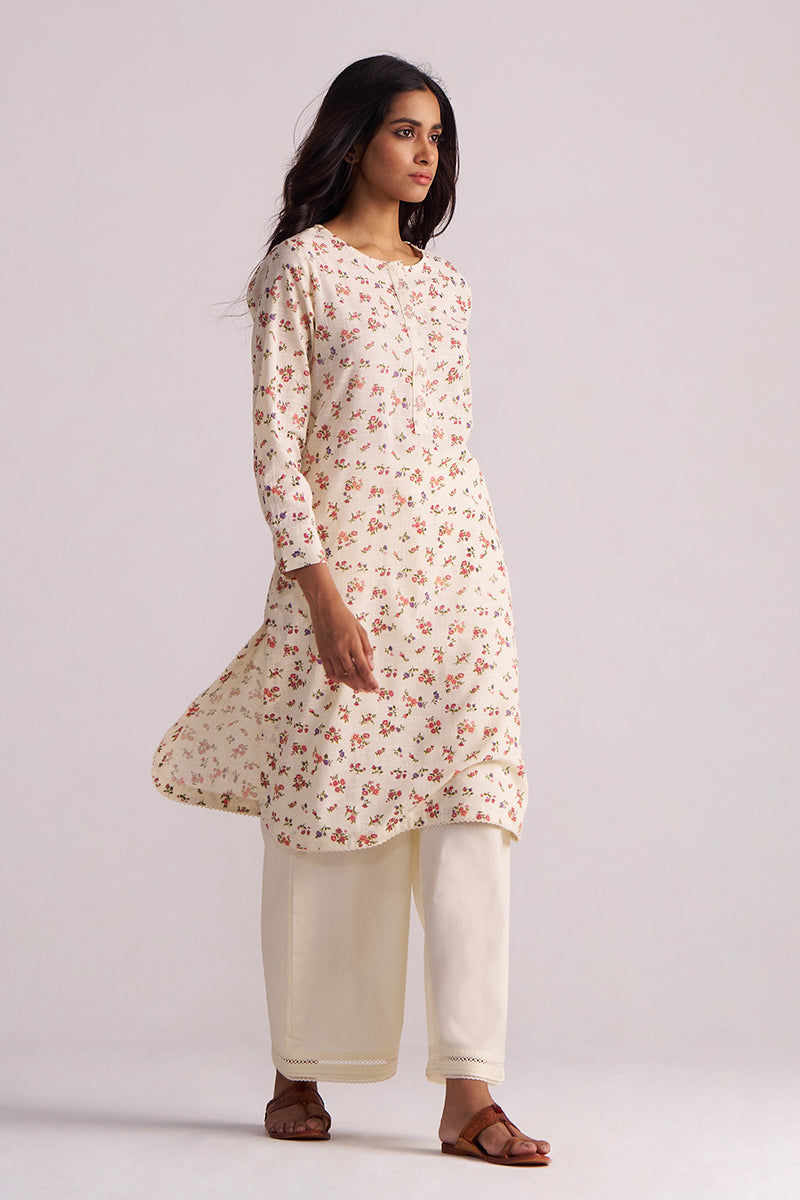 Woman wearing a Cream and Pink Tiny Floral Hand-Print Co-ord Set on a light gray background