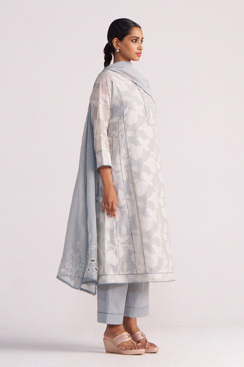 Woman wearing a Grey Woven Pheran Kurta Set on a white background
