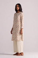 Woman wearing a Cream and Pink Tiny Floral Hand-Print Co-ord Set on a light gray background
