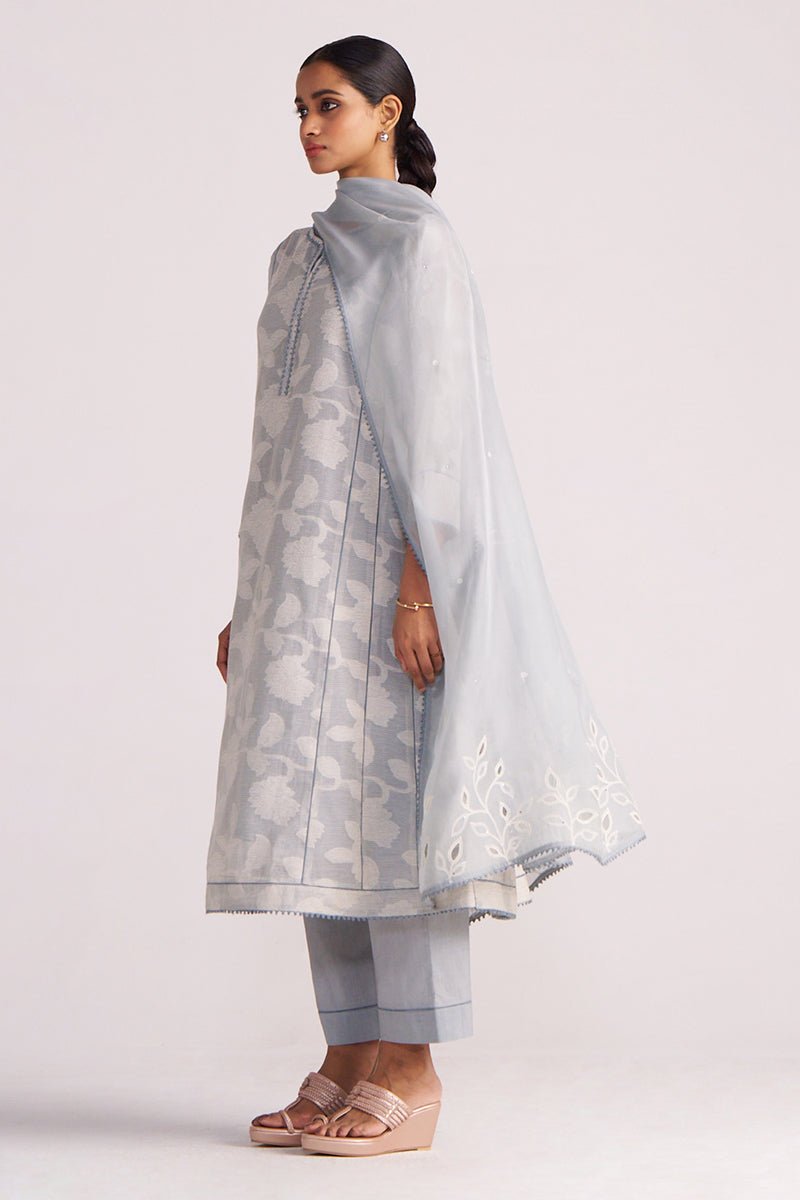 Woman wearing a Grey Woven Pheran Kurta Set on a white background