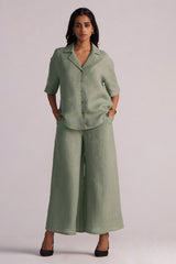 Woman wearing a Lily Pad Green Pure Linen Co-ord Set pants on a plain background