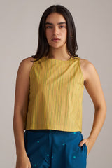 Woman wearing a yellow sleeveless top with blue pants against a neutral background | Navigate Blue Checkard Kimono with Moss Yellow Top and Blue Bottom Co Ord Set