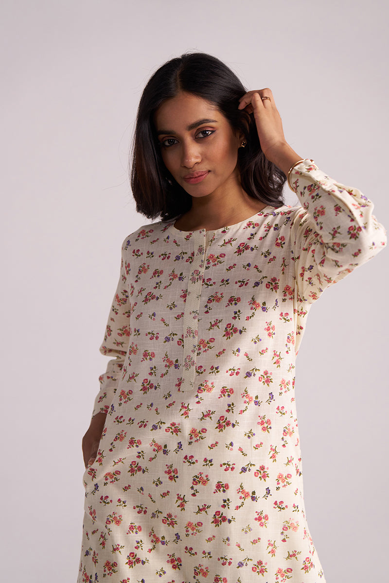 Woman wearing a Cream and Pink Tiny Floral Hand-Print Co-ord Set against a plain background