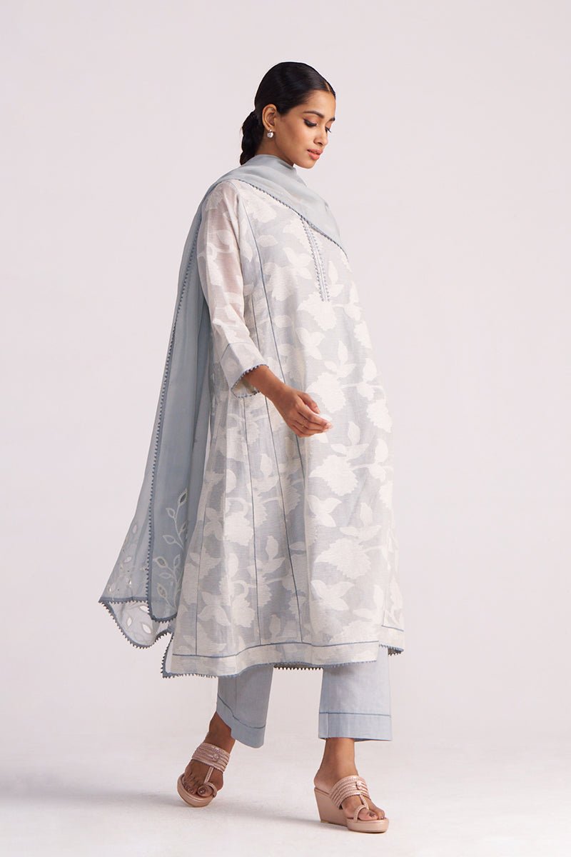 Woman wearing a Grey Woven Pheran Kurta Set outfit on a white background
