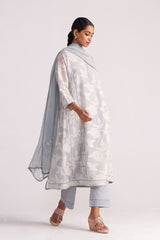 Woman wearing a Grey Woven Pheran Kurta Set outfit on a white background