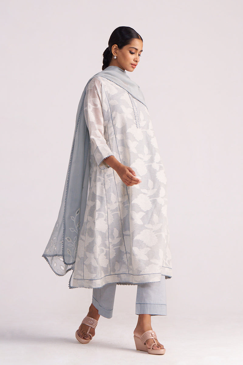 Woman wearing a Grey Woven Pheran Kurta Set outfit on a white background