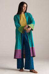 Woman wearing a teal and purple traditional outfit on a plain background | Navigate Blue Checkard Kimono with Moss Yellow Top and Blue Bottom Co Ord Set