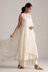 Woman wearing a white dress with a plain background | Ivory Kota Silk Kurta Set for Women