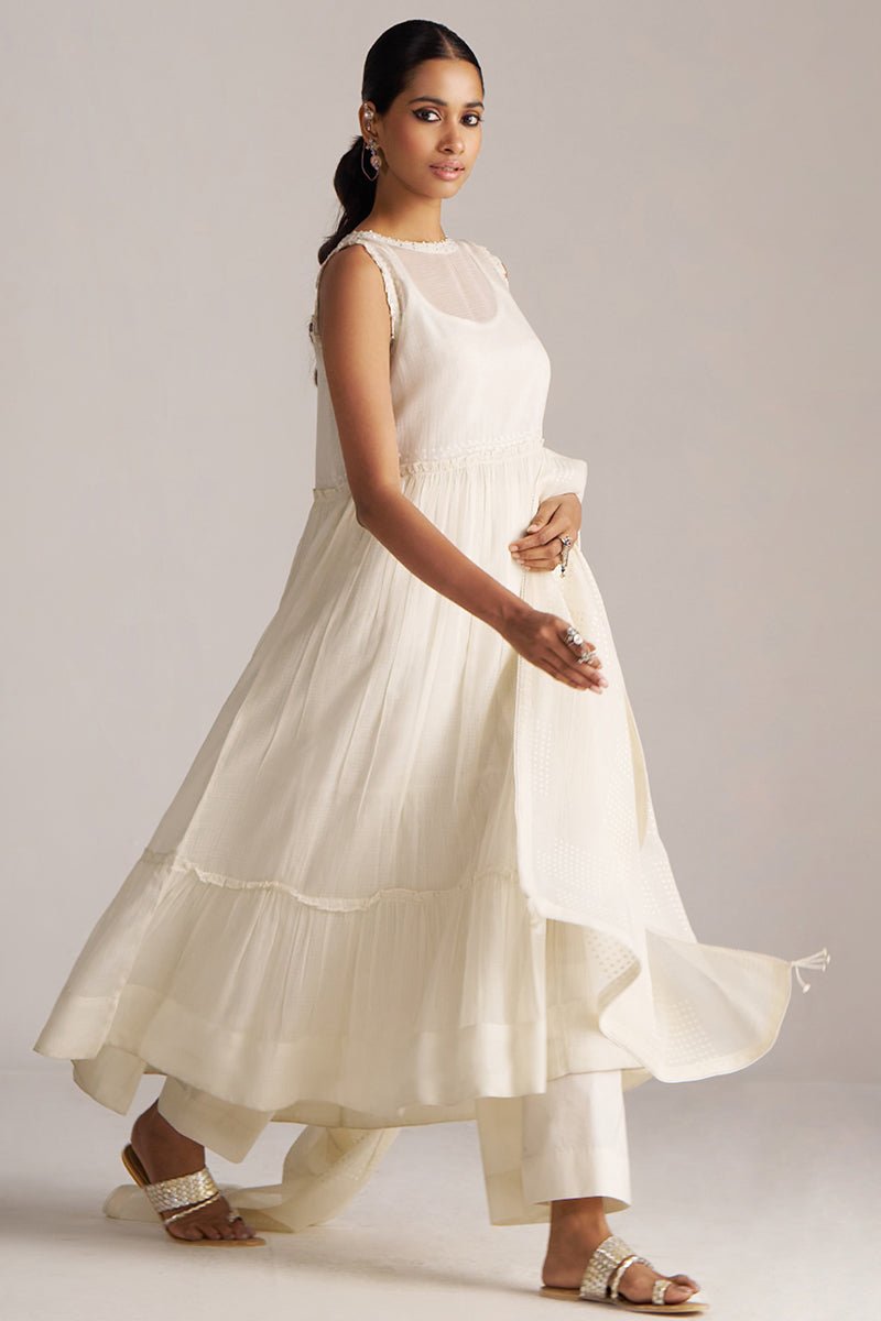 Woman wearing a white dress against a plain background | Ivory Kota Silk Kurta Set for Women