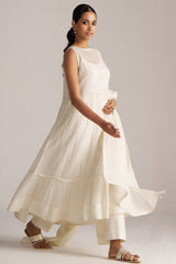 Woman wearing a white dress against a plain background | Ivory Kota Silk Kurta Set for Women