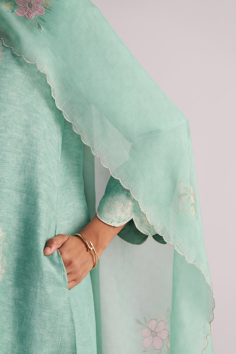 Light green fabric with Dusty Jade Green Woven Silk Kurta Set on a plain background