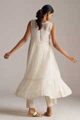 Woman wearing a white sleeveless dress with a plain background | Ivory Kota Silk Kurta Set for Women