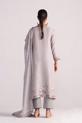 Woman wearing a Grey Woven Kurta Set with a long scarf on a white background