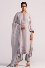 Woman wearing a Grey Woven Kurta Set and matching dupatta on a white background