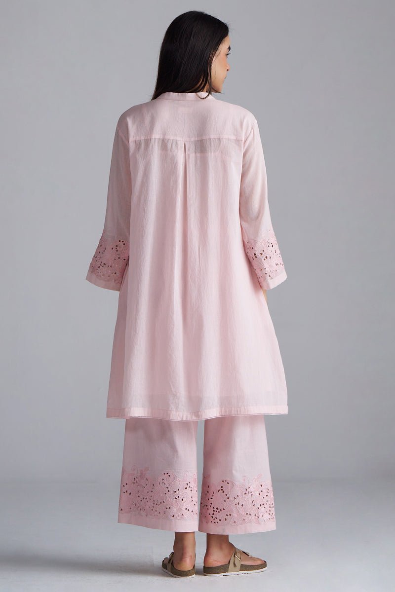 Woman wearing a light pink embroidered outfit on a gray background, Crystal Pink Mul Mul Co-ord Set for Women | Ganga Fashions