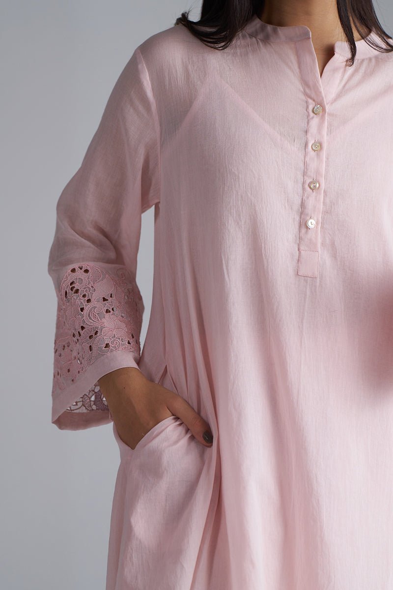 Pink kurta with lace detailing on sleeves against a gray background, Crystal Pink Mul Mul Co-ord Set for Women | Ganga Fashions