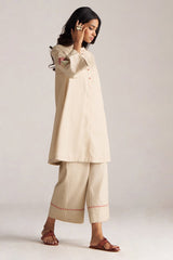 Woman wearing a beige traditional outfit with a plain background | Brown Rice Co-ord Set – Solid Ethnic Wear | Ganga Fashions