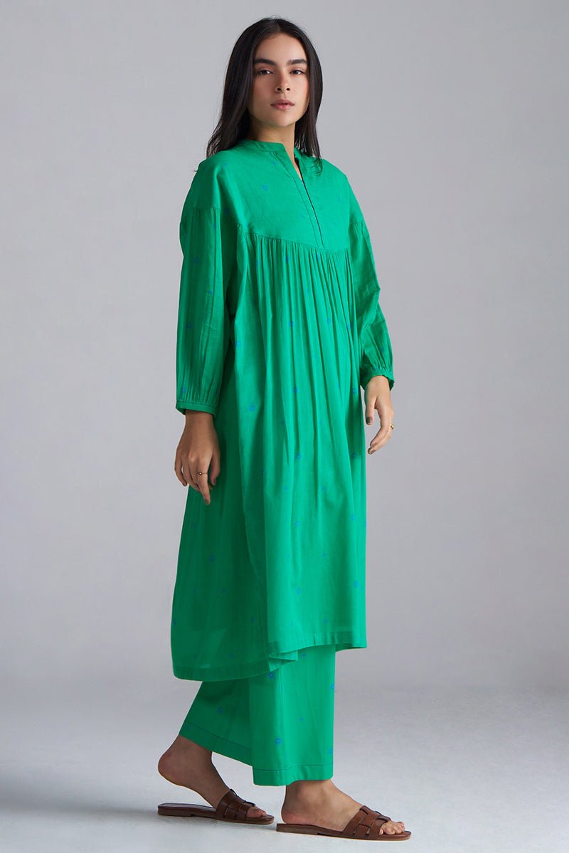 Woman wearing a green dress against a gray background, Holly Green Mul Mul Co-ord Set for Women | Ganga Fashions