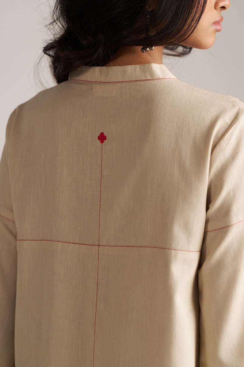 Beige jacket with a red flower detail on the back, worn by a person. | Brown Rice Co-ord Set – Solid Ethnic Wear | Ganga Fashions
