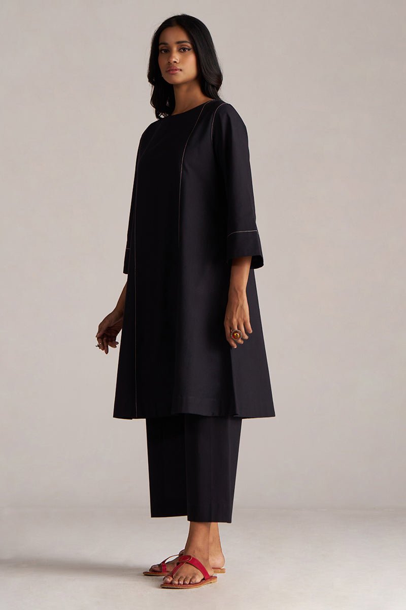 Woman wearing a black outfit against a plain background | Black Co-ord Set – Ethnic Wear for Women | Ganga Fashions