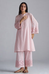 Woman wearing a light pink traditional outfit with intricate embroidery on a gray background, Crystal Pink Mul Mul Co-ord Set for Women | Ganga Fashions