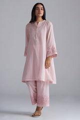 Woman wearing a light pink kurta with embroidered details on a plain background,Crystal Pink Mul Mul Co-ord Set for Women | Ganga Fashions