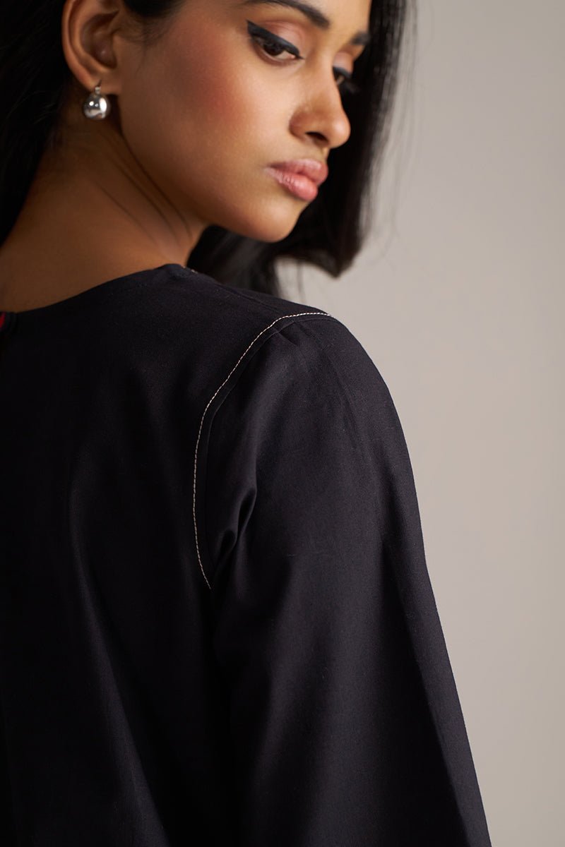 Woman wearing a black outfit with a plain background | Black Co-ord Set – Ethnic Wear for Women | Ganga Fashions