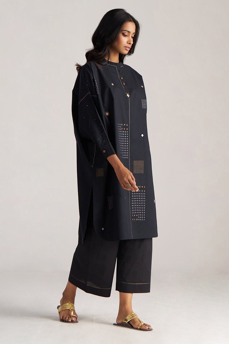 Woman wearing a black outfit with geometric patterns on a light gray background, Black Cotton Co-ord Set for Women | Rangmanch | Ganga Fashions