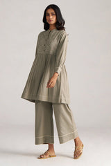 Woman wearing a light green traditional outfit with a plain background | Buy Grey Co-ord Set for Women | Rangmanch Collection - Ganga Fashions