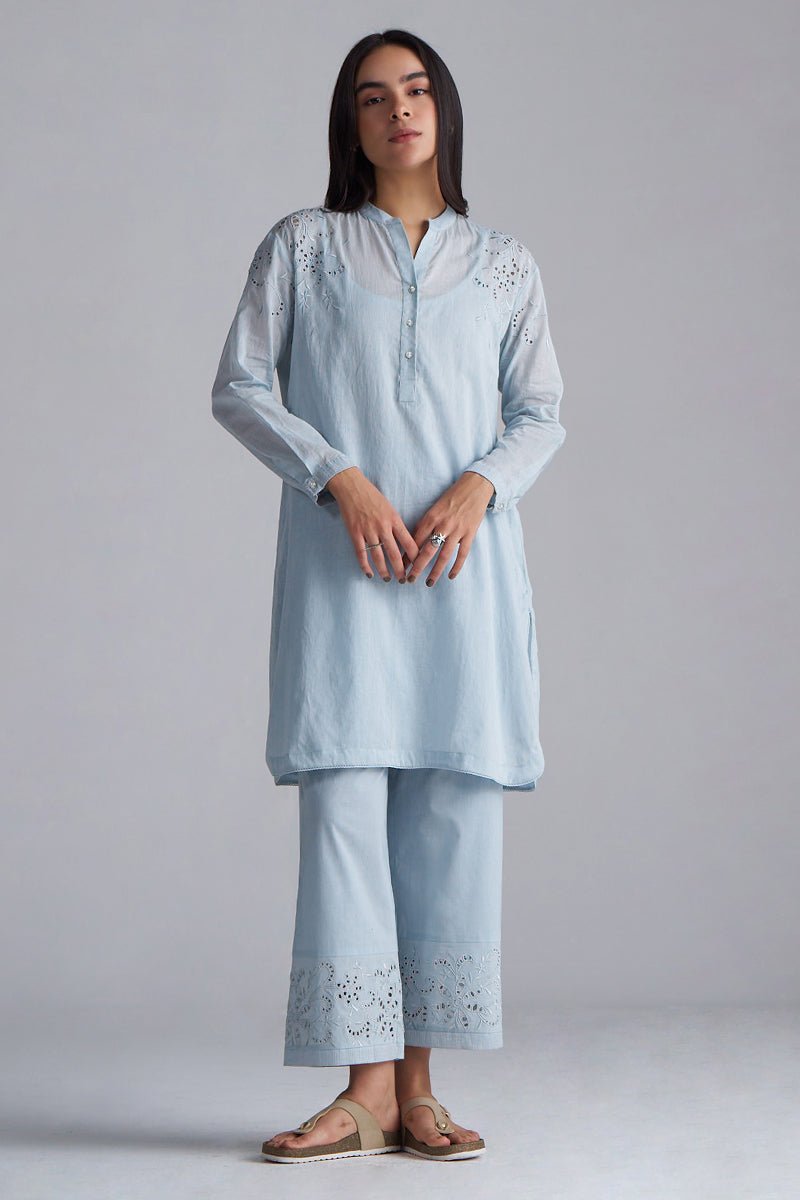 Woman wearing a light blue kurta with embroidery on a plain background | Chalk Blue Mul Mul Co-ord Set for Women | Ganga Fashions