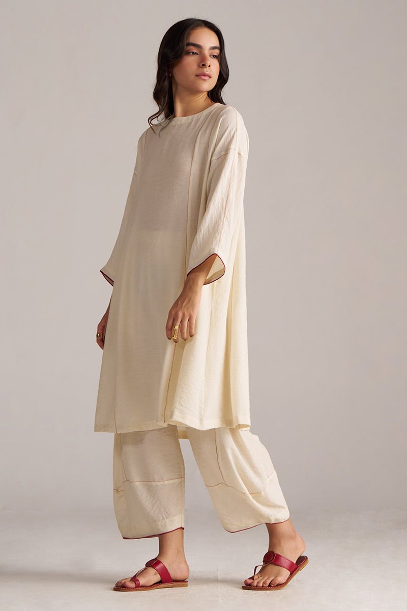 Woman wearing a cream-colored outfit with wide-leg pants against a plain background, Birch Cream Co-ord Set for Women | Rangmanch | Ganga Fashions