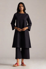 Woman wearing a black outfit with a plain background | Black Co-ord Set – Ethnic Wear for Women | Ganga Fashions