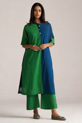 Woman wearing a green and blue outfit on a plain background | Blue and Green Mul Mul Co Ord Set