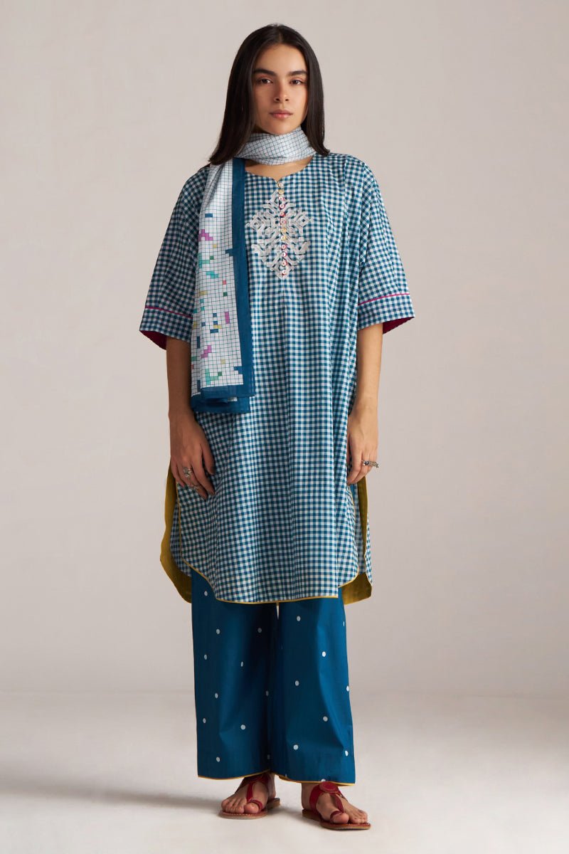 Woman wearing a blue checkered kurta with a matching dupatta on a plain background | Blue and White Mul Mul Checkard Co Ord Set with Stole