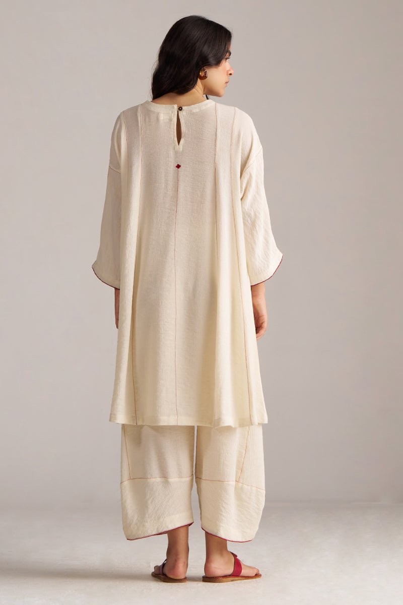 Woman wearing a cream kurta with pants against a plain background, Birch Cream Co-ord Set for Women | Rangmanch | Ganga Fashions