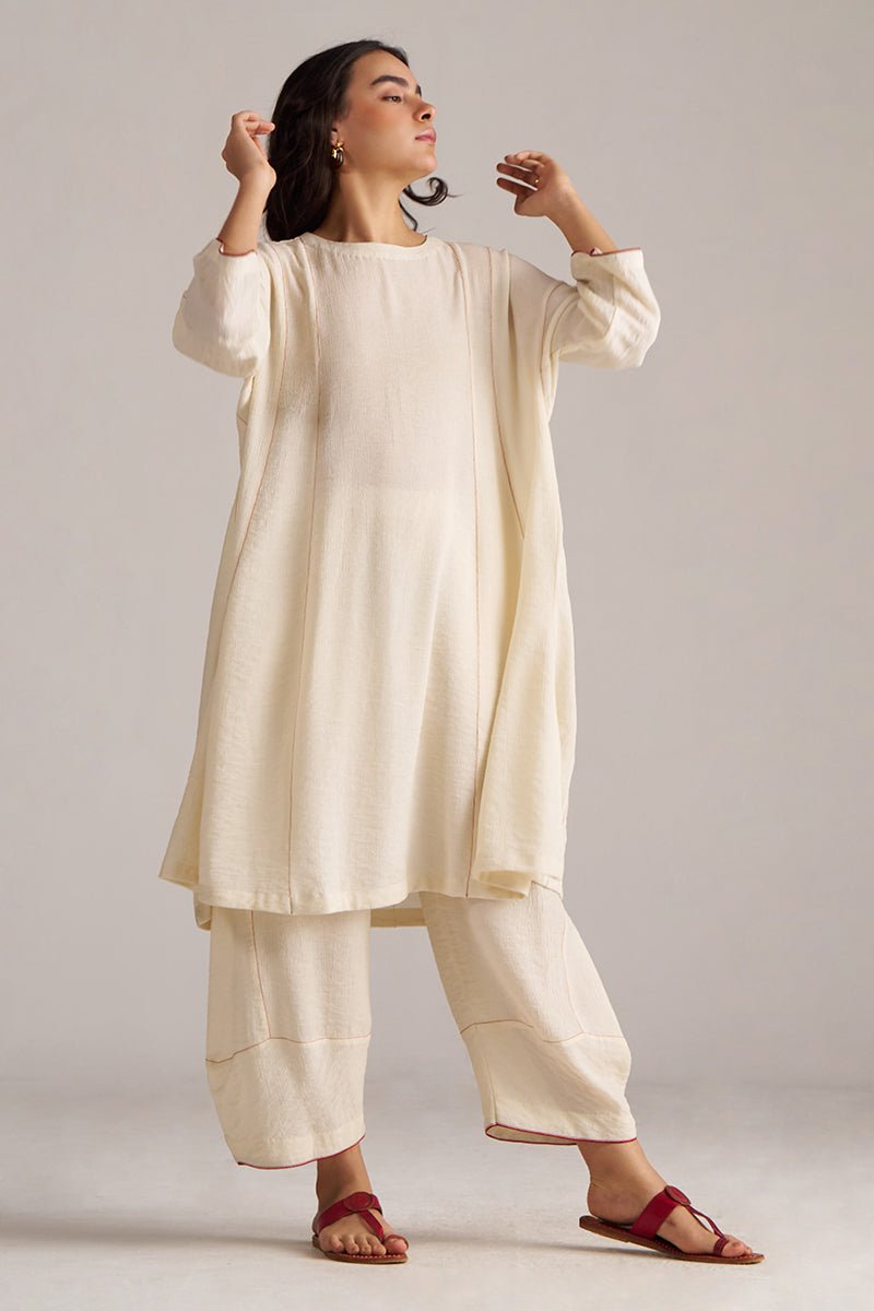 Woman wearing a cream-colored traditional outfit with a plain , Birch Cream Co-ord Set for Women | Rangmanch | Ganga Fashionsbackground