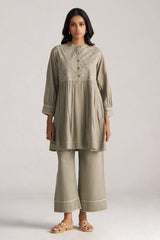 Woman wearing a beige traditional outfit with a plain background | Buy Grey Co-ord Set for Women | Rangmanch Collection - Ganga Fashions