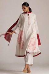 Woman wearing a white kurta with red floral patterns and matching dupatta on a plain background | Buy Ivory and Maroon Pure Chanderi Kurta Set - Ganga Fashions