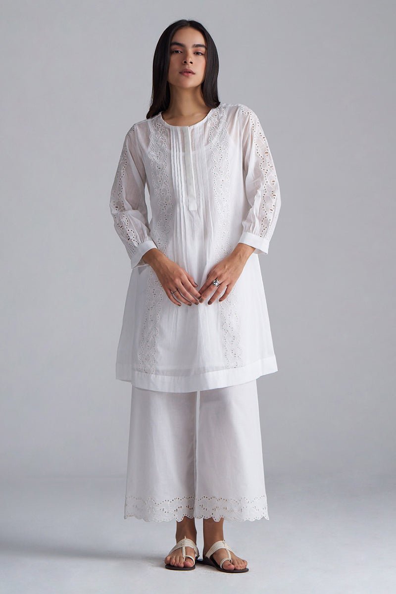 Woman wearing a white embroidered outfit on a plain background, White Mul Mul Co-ord Set for Women | Rangmanch | Ganga Fashions