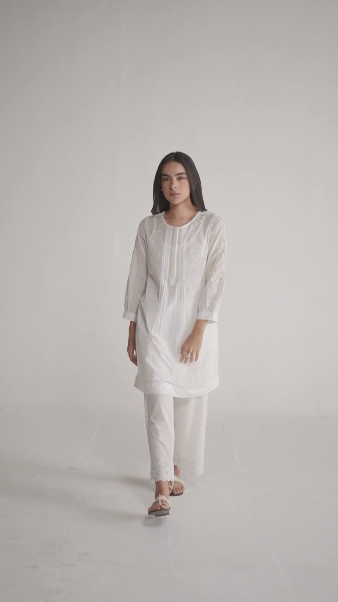 Woman wearing a white embroidered outfit on a plain background, White Mul Mul Co-ord Set for Women | Rangmanch | Ganga Fashions